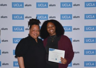 director of CEED and scholarship winner pose for photo
