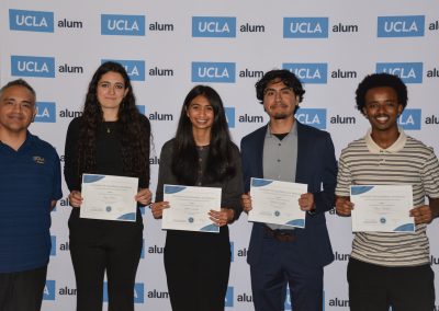 small group of scholarship winners pose holding certificates
