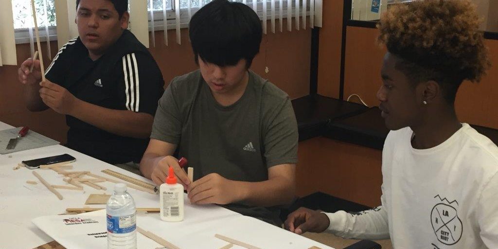 SMASH Academy Participants begin building with wood and glue.
